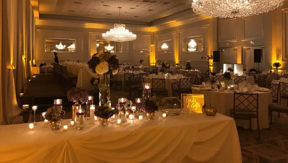 Amber uplighting under chandeliers