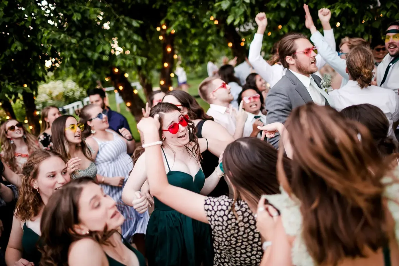 Guests packing the dance floor at a wedding reception