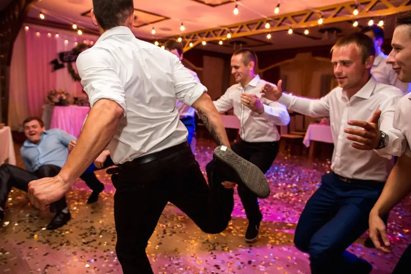 A packed dance floor glowing at a lively celebration