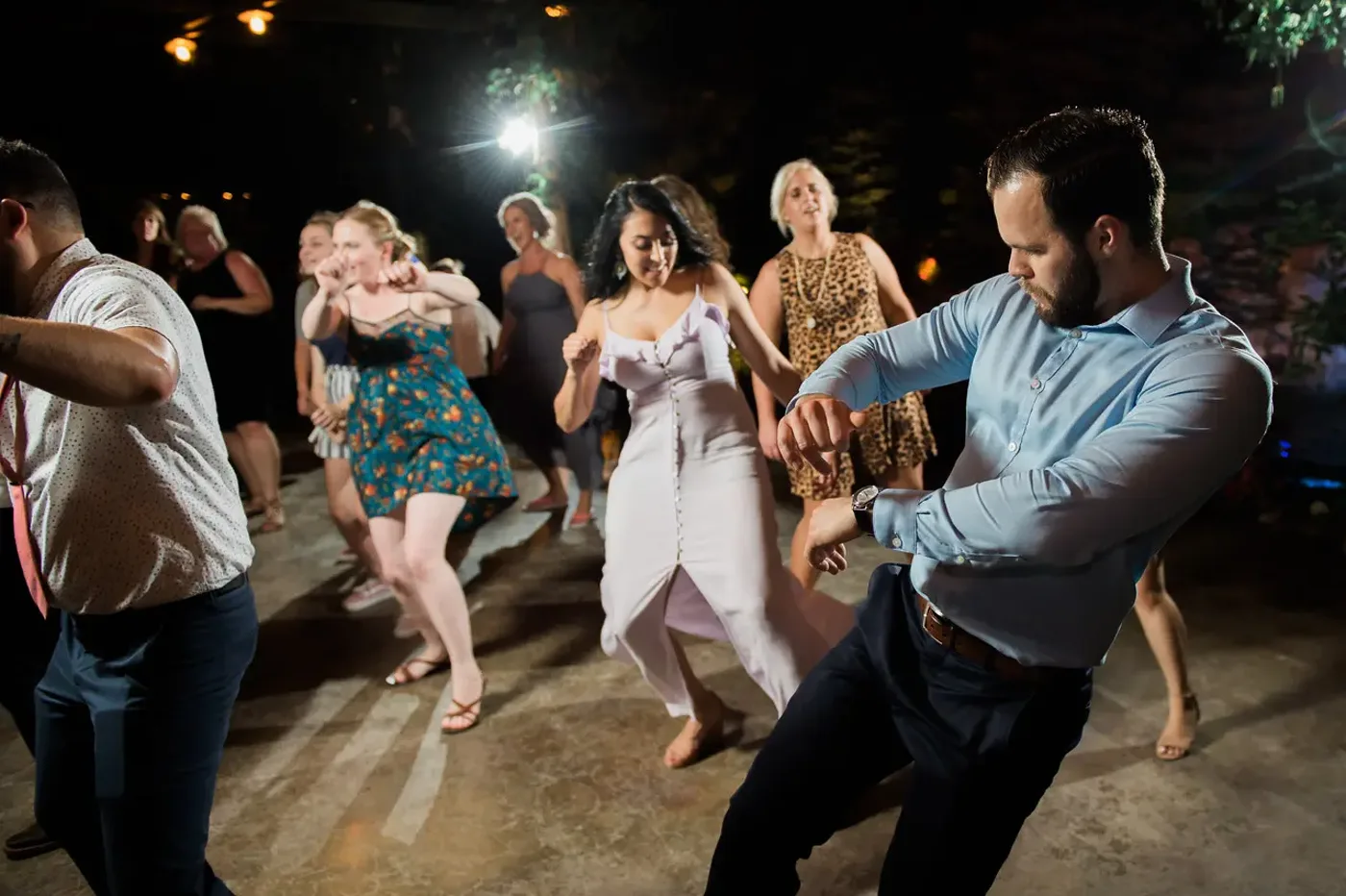 Guests packing the dance floor at a wedding reception