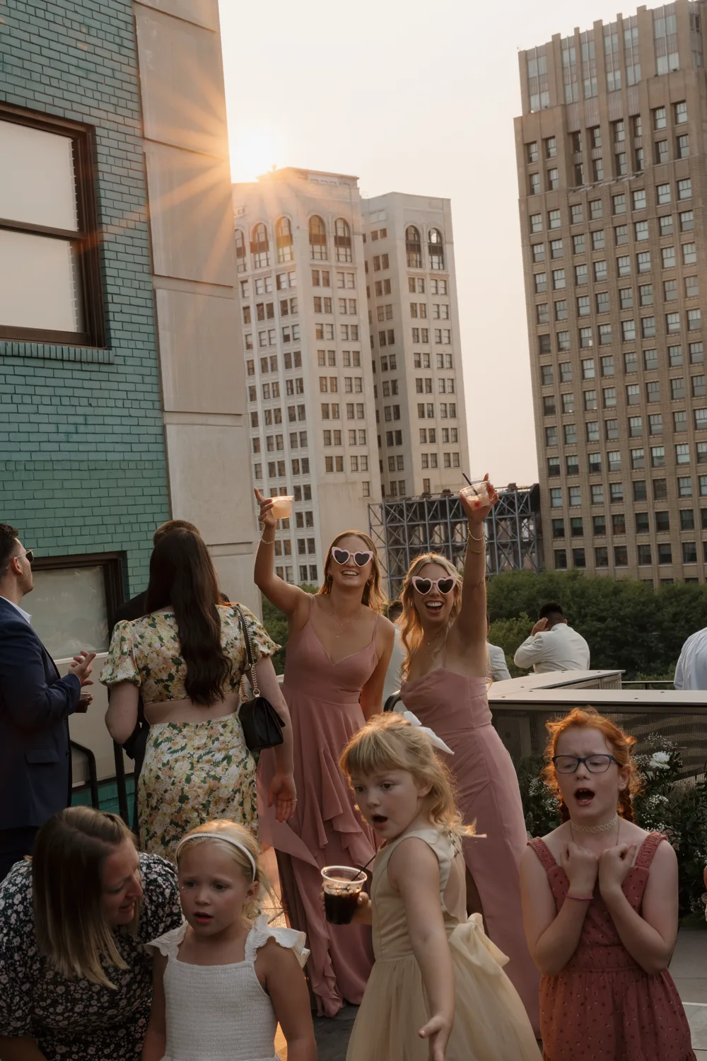Couple kissing at a Detroit rooftop wedding reception