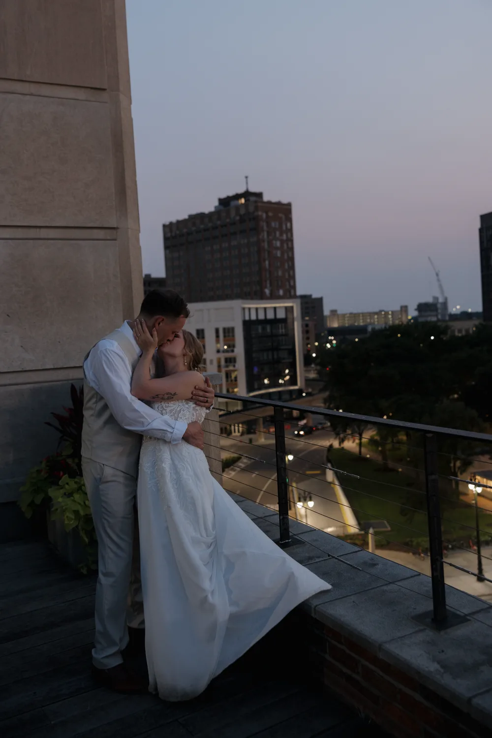 Couple embracing at golden hour before their fall barn wedding reception near Detroit