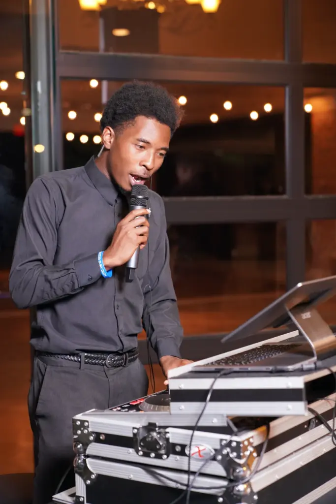 Skan the DJ on the microphone at a Michigan wedding reception