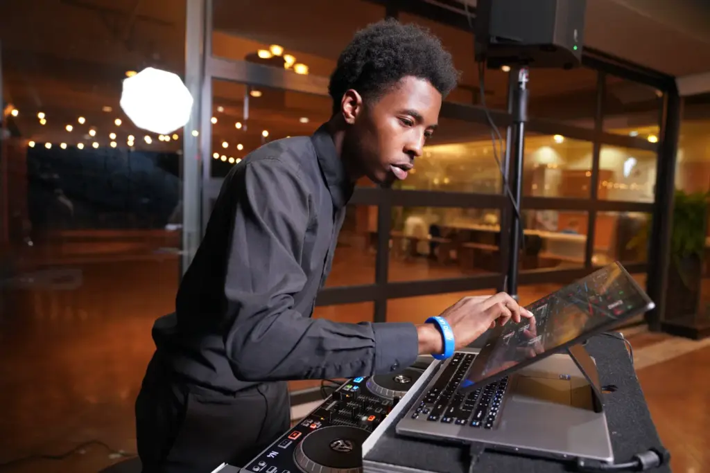 Skan the DJ mixing music at a Detroit wedding reception