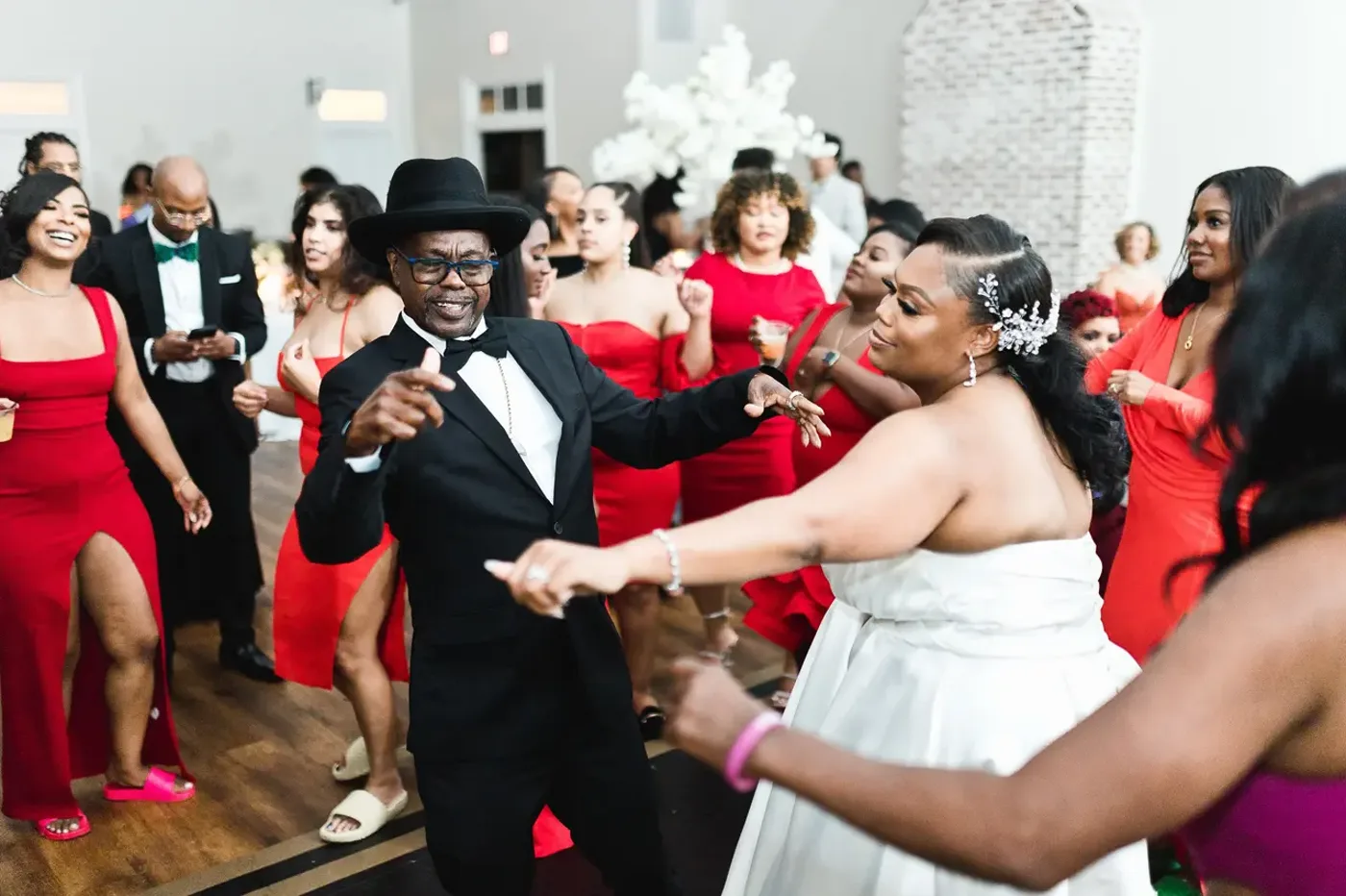 A red-dress guest dancing with the crowd