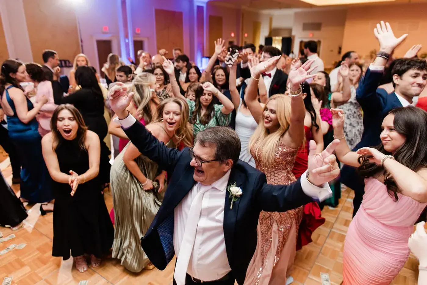 Packed dance floor with the crowd cheering