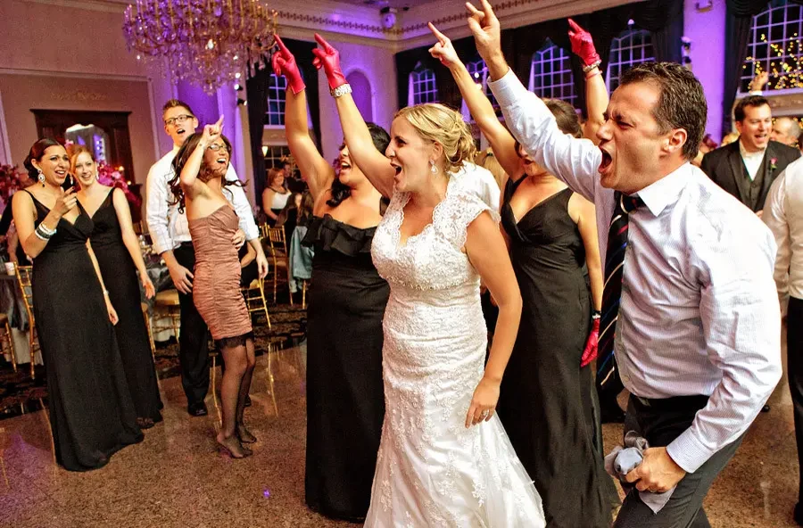 Couple dancing with the wedding party